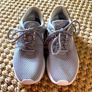 Gray Nike tennis shoes